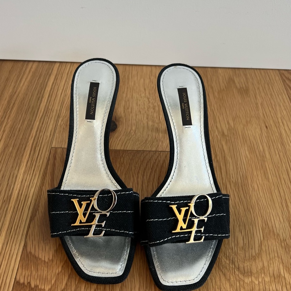 Louis Vuitton heeled mules. Very cute, just too snug. Worn a handful of times.